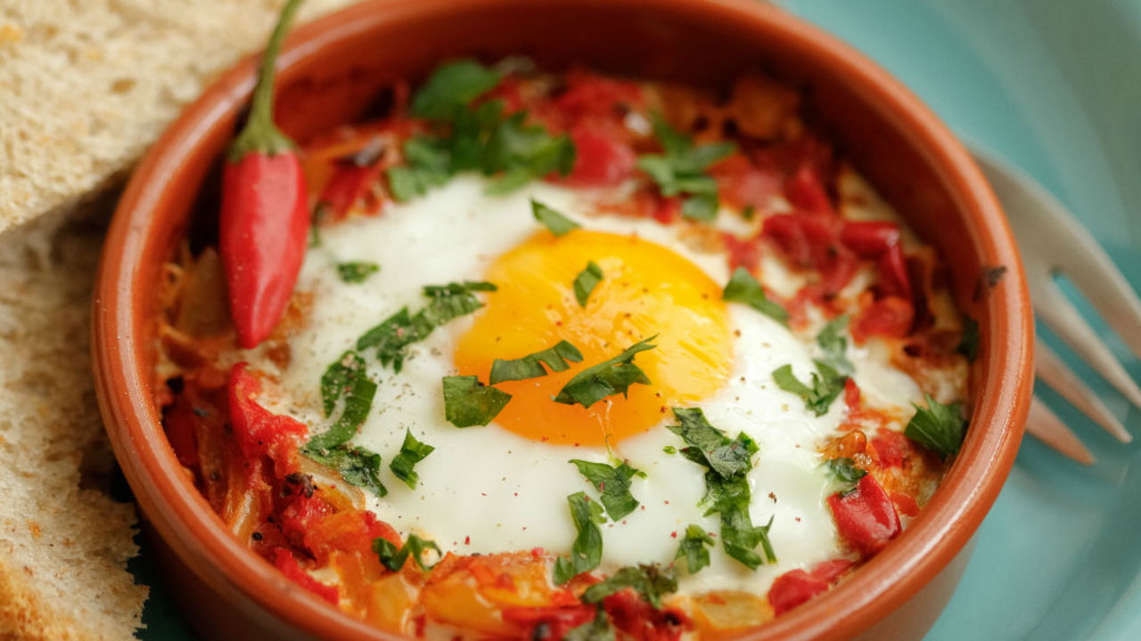 Spanish baked eggs with Don Carlos olives and harissa